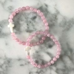 A dainty Mother of Pearl cross adorns these hand strung Pink Jade beaded bracelets. These look great paired with our Gold Ball Beaded Bracelet or our Name Bracelets! I love mixing textures together! This bracelet is made with high quality elastic. This bracelet stretches to fit most wrists and is approximately 6.5-7" in length + 6" for kiddos. Details:- Pink Jade Beading- Mother of Pearl Cross- Stretches to fit most wrists approximately 6.5-7" in length + 6" for kiddos. Your jewels will arrive i Name Bracelets, Pink Jade, Personalized Gifts For Mom, Cross Bracelet, Name Bracelet, Earring Sale, Jade Beads, Pink Bracelet, Personalized Necklace