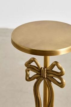 a gold table with a bow on it