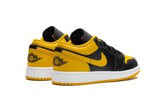 The Air Jordan 1 Low GS “Yellow Ochre” is the youth sizing of the retro basketball shoe in a black-and-yellow design.  The Jordan 1 Low “Yellow Ochre” features a yellow perforated leather toe, a yellow leather Swoosh, and a yellow leather heel tab.  Additional yellow accenting can be found on the collar and on the Jumpman branding on the tongue.  The toe, forefoot, eyelets, and mid-panel appear in black leather.  A black “Wings” logo is embroidered on the heel.  Release date: December 18, 2023 Jordan 1 Low Yellow, Jordan 1 Yellow, Retro Basketball Shoes, Retro Basketball, Yellow Design, Yellow Ochre, Wings Logo, Black Wings, Stadium Goods