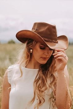 This womens leather cowboy hat is the perfect pairing of form and function. Built using durable, finished, 100% leather, it's built to last and protect you from the sun and rain on any adventure. Yet with its curved brim, all-leather braided band, and beautiful finish, it's one of our best-looking hats. Choose from a bright, stylish copper leather, or all-black desperado look. This hat is perfect for you! Leather Hat Bands For Summer Outdoor, Casual Leather Hat Bands For Rodeo, Rugged Leather Hat Bands For Ranch, Rugged Leather Hats For Ranch, Casual Leather Hat For Rodeo, Leather Hats For Rodeo In Summer, Leather Hat Bands For Ranch In Summer, Leather Hats For Summer Rodeo, Leather Hat Bands For Summer Ranch Events