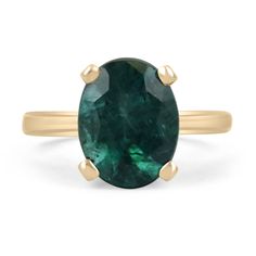 A gorgeous solitaire emerald ring. This beautiful piece showcases a large 3.31-carat, natural, Zambian oval cut emerald. The gemstone has a lustrous, dark forest green color with a deep bluish-green hue. Set in a simple, four-prong 14K yellow gold setting.  Setting Style: Prong Setting Material: 14K Yellow Gold Setting Weight: 4.3 Grams Main Stone: Emerald Shape: Oval Cut  Weight: 3.31-Carats Clarity: Semi-Transparent Color: Dark Forest Green Hue: Dark Bluish-Green Luster: Very Good Treatments: Emerald Green Oval Engagement Ring, Gia Certified Green Oval Sapphire Ring, Classic Oval Green Sapphire Ring, Classic Green Oval Sapphire Ring, Classic Green Sapphire Oval Ring, Timeless Oval Emerald Ring With Polished Finish, Oval Sapphire Ring May Birthstone Fine Jewelry, Oval Solitaire Emerald Ring For May Birthstone, Oval Emerald Ring With Prong Setting