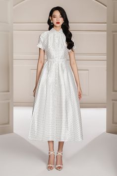 Crafted from a luxuriously soft taffeta material, it features a classic shirt collar, fit and flare style, and a beautiful midi length. Perfect for any elegant occasion. Elegant Silk Midi Dress With Full Skirt, Elegant Polka Dot Silk Dress, Elegant Silk Polka Dot Dress, Elegant Polka Dot Midi Dress For Spring, Elegant Polka Dot Dress For Work, Polka Dot Short Sleeve Formal Dress, Formal Short Sleeve Polka Dot Dress, Elegant Short Sleeve Polka Dot Midi Dress, Elegant Polka Dot Formal Dresses