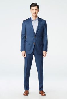 Classic, versatile and reliable - the Hemsworth is your tried-and-true deep blue suit. This solid-colored number in pure premium wool stands up to whatever the daily hustle throws at you. Tailored Blue Wool Suit, Blue Wool Suit With Pressed Crease, Blue Wool Suits With Pressed Crease, Blue Wool Suits For Workwear, Blue Wool Suits For Work, Fitted Wool Suit In Solid Color, Fitted Solid Wool Suit, Tailored Solid Wool Suit, Tailored Wool Suits In Solid Color