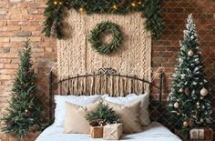 a bedroom decorated for christmas with wreaths on the wall