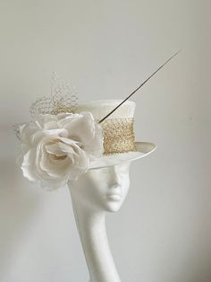 Ivory white gold hat This amazing ivory white gold hat is made from ivory colour sinamay fabric. On the side is sitting silk flower and gold netting and a gold feather. the hat will be an amazing accessory to compliment your outfit. It will fit the average head size 54-55cm You can wear this amazing hat at the wedding, Christening, Royal Ascot races, and any other special occasion. Enjoy and please have a look at my hats and fascinators in my shop  https://www.etsy.com/uk/shop/KristineRosahats?r White Adjustable Top Hat With Short Brim, Adjustable White Top Hat With Short Brim, White Fitted Top Hat With High Crown, Elegant Fitted Costume Hat With Tall Crown, Cream Short Brim Top Hat For Formal Occasions, Gold Top Hat With Short Brim For Kentucky Derby, Gold Costume Hats For Kentucky Derby With Short Brim, Gold Costume Hat With Short Brim For Kentucky Derby, White Structured Crown Hat For Kentucky Derby