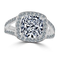 a cushion cut diamond ring set with pave diamonds