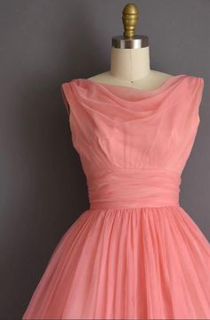 Purchased from seller simplicityisbliss in 2018 never had the chance to wear :( Vintage 1950s pink chiffon party/bridesmaid dress by Lorrie Deb. The dress features a draped neckline with fitted bodice, a nipped waist, and a free full skirt. There is a back metal zipper for closure ✂------ M E A S U R E M E N T S ------- best fit: extra small bust: 33" waist: 24" hips: open fit total length: 46" tag/label: Lorrie Deb material: chiffon condition: near excellent, there is one very small area on the hem that is lower than the rest as seen in photos. Mostly only noticeable when wearing a petticoat. Orginal photos (grey background) and recent photos dress is slightly wrinkly from being packed. 50s Pink Dress, 1950s Style Pink Party Vintage Dress, Fluffy Dresses, Pink Sleeveless 1950s Style Dress, 1950s Pink Vintage Dress With Short Sleeves, Pink 1950s Vintage Summer Dress, 1950s Pink Sleeveless Dress, 50s Aesthetic, Draped Neckline