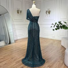 Radiating elegance and allure, this green mermaid evening gown is perfect for upscale wedding affairs in 2024. The mermaid silhouette gracefully accentuates curves, offering a flattering and glamorous fit, while the one-shoulder design adds a touch of sophistication. Featuring a high split, the gown exudes modernity and adds a hint of drama to your look, allowing for graceful movement. Adorned with intricate beadwork, it sparkles with every step, ensuring all eyes are on you as you celebrate in Upscale Wedding, Mermaid High, Graceful Movement, Mermaid Evening Gown, Green Mermaid, Mermaid Silhouette, Shoulder Design, Evening Gown, Evening Dress