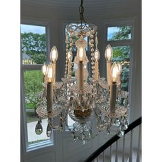 a chandelier hanging from the ceiling in a room