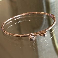 New Rose Gold Bangle Bracelet By Kate Spade. A Bow On The Top And A Box Tab Insert Clasp. Chic Rose Gold Jewelry With Bracelet Strap, Feminine Adjustable Party Bracelets, Feminine Adjustable Bracelets For Party, Adjustable Feminine Party Bracelets, Feminine Rose Gold Metal Jewelry, Adjustable Pink Gold Bracelet For Party, Elegant Pink Gold Metal Bracelets, Elegant Rose Colored Bracelet Jewelry, Feminine Rose Gold Bracelets For Party