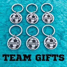 six soccer key chains with the words team gifts written on them in black and white