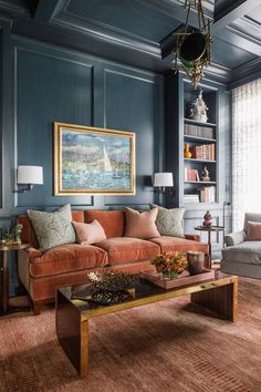 the living room is decorated in blue and orange tones, with an old - fashioned coffee table