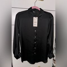 Zara - Satin Button Down Shirt/Blouse In Black Size Small Brand New Tag Attached Great For Work, Going Out, Business Casual, Dressy. It’s Big So There’s Many Ways You Can Style It. (I Have Added A Photo Of The Shirt In The Pink Color So You Can See What The Shirt Looks Like On The Model. But This Post Is For Selling The Black Color Of It) Zara Button-up Office Shirt, Zara Fitted Button-up Shirt, Black Silk Shirt With Button Closure, Zara Black Button-up Blouse, Satin Button Down Shirt, Black Satin Button-up Blouse, Layering Tank Tops, Oversized Button Down Shirt, White Long Sleeve Dress