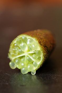 a close up of a piece of fruit on a table