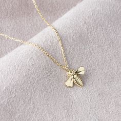 "10k 14k 18k Solid Gold Bee Necklace, Gold Bee Pendant, Animal Necklace, Bee Charm, Christmas Gift, Valentines Day Gift, Mothers Day Gift Our product weighs 1.49 gr and the chain length is 42 cm. All of our products has the stamp \"585\" on them. (which states that this is real gold) Your products will be shipped with free shipping UPS express within 1-3 business days. There may be +/- 0.15 change in gram information due to production. Your products will be shipped with free shipping UPS express Fine Jewelry Charm Necklace As Gift, Dainty Pendant Charm Necklace, Gold Charm Necklaces As Gift, Gold Charm Necklaces Perfect For Gifts, Yellow Gold Charm Necklaces With Hallmark For Gifts, Yellow Gold Charm Necklaces With Hallmark As Gift, Silver Charm Necklace Stamped 14k As Gift, Yellow Gold Hallmark Charm Necklace As Gift, Gift Silver Charm Necklace Stamped 14k