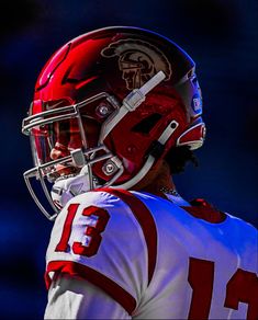 a football player wearing a red and white uniform