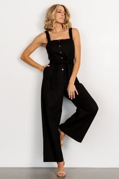 Baltic Born exclusive style Adorable jumpsuit for a day out on the town Solid soft black color Linen blend material has no stretch Straight neckline Functional buttons down bodice Tank sleeves Hidden pockets on both sides Removable self-tie belt at waist Wide-leg pant style Unlined Trina is 5'6, cup size 32D, size 2 and is wearing size S Baltic Born, Straight Neckline, Jumpsuit Black, Pant Style, Cup Size, Black Jumpsuit, Soft Black, Tie Belt, Fashion Pants