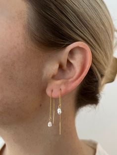 We are in love with this threader style earring! We added a tiny freshwater pearl to elevate this look even more 14k gold filled, water and tarnish resistant Long Delicate Earrings, Thread Through Earrings, Delicate 14k Gold Filled Threader Earrings, Everyday 14k Gold Dangle Pearl Earrings, Delicate 14k Gold Filled Linear Earrings For Everyday, Dainty Long Drop Pearl Earrings For Everyday, Everyday 14k Gold Filled Long Drop Pearl Earrings, Dainty Yellow Gold Teardrop Pearl Earrings, Dainty 14k Gold Filled Linear Earrings For Everyday