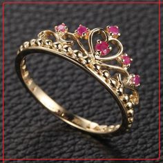 ◈ Jewelry Type - Crown Ring (Engagement Ring) ◈ Material - 10K Solid Gold (14K & 18K also available - Additional fees may apply) ◈ Stamp - 10K ◈ Gold Color - Rose Gold, White Gold, Yellow Gold ◈ Gemstone Name - Natural Ruby (July Birthstone) ◈ Gemstone Shape - Round ◈ Theme - Engagement Ring and Anniversary Ring, ◈ Occasion - Engagement Ring, Anniversary Ring, Wedding Ring, Birthday Ring, Gift For Her, Lover Gift Etc. ◈ Gender - Female ◈ Gift Packaging and Message Available  ◈ Free Shipping Through FedEx Express and Jewelry Polishing Cloth, Jewelry Care Card and Packing Box With Product Ruby Crown, Crown Engagement Ring, Birthstone Engagement Rings, Ruby Wedding Rings, Micro Pave Ring, July Birthstone Ring, Red Crown, Handmade Engagement Rings, Ruby Engagement Ring