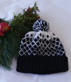 Black and White hand crafted knit hat with pompom.  Fair Isle style knitted in pure 100% wool.  Unisex Size M/L.  Hand wash and dry.  You will love this hat!  Hand made with love by me. L Hand, Fair Isle Pattern, White Hand, Kissimmee, Knit Hat, Fair Isle, Beautiful Hand, Caps Hats, Knitted Hats