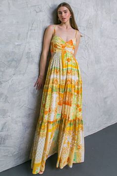 Step into the night in stylish confidence with the MY DREAM DATE MAXI DRESS. This printed maxi dress features a V neckline that plunges alluringly, a stylish side cut-out and a tiered skirt that accentuates the feminine silhouette. This dress is the perfect mix of style and comfort for any special occasion. Details Self: 100% Polyester Lining: 100% Polyester Size & Fit - Model is 5`8" And Wearing Size Small - Measurements Taken From Size Small - Approx. Length: 51" Yellow Printed Maxi Dress For Party, Chic Yellow Floor-length Dresses, Yellow Printed V-neck Maxi Dress, Yellow Floor-length Maxi Dress For Spring, Yellow V-neck Maxi Dress For Vacation, Printed Sleeveless Yellow Maxi Dress, Printed Yellow Maxi Dress, Chic Flowy Yellow Maxi Dress, Yellow Maxi Dress For Spring