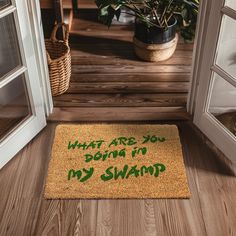 a door mat that says what are you doing in my swamp? on the floor