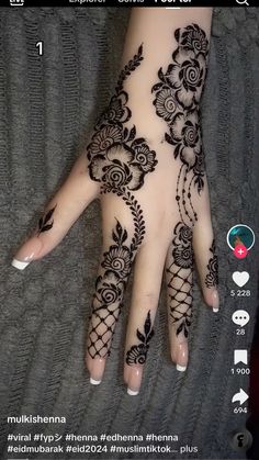 the henna is on someone's hand and it looks like they are getting tattoos