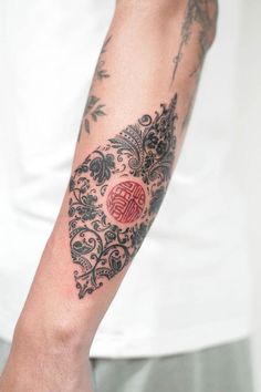 a person with a tattoo on their arm