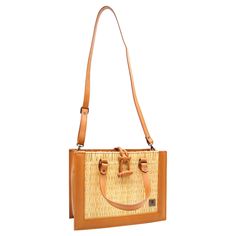 Product Description Classic but bold, this straw handbag is crafted with organic reed allied with vegetable tanning leather details, making it a timeless bag. Handmade using traditional Portuguese woven methods, by a family of master artisans, this is a masterpiece that unites old-world weaving techniques with a modern look. Designed so that you can make the most of your day-to-day life. Take it to the office or on a date and be assured that your outfit will pop from the others. Its removable sh Leather Straw Bag With Bamboo Double Handle, Eco-friendly Brown Straw Bag With Woven Leather, Eco-friendly Brown Woven Leather Straw Bag, Woven Leather Satchel In Natural Color, Natural Leather Bags With Bamboo Handle, Natural Leather Bag With Bamboo Handle, Rattan Straw Bag With Bamboo Handle, Rectangular Straw Shoulder Bag With Woven Leather, Rectangular Woven Leather Straw Shoulder Bag