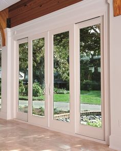 the inside of a house with glass sliding doors