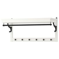 a white shelf with two hooks on the top and one black rail in front of it