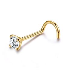 a gold nose ring with a single diamond on it's end, against a white background