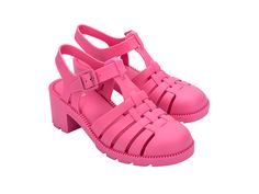 a pair of pink shoes with straps on them