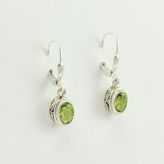 Sku 6400 Sterling Silver Peridot 5x7mm Oval Bali Leverback Dangle Earrings 1"l x 1/4"w Oval Peridot Silver Jewelry, Oval Peridot Earrings For Gift, Silver Peridot Drop Earrings, Silver Peridot Dangle Earrings, Peridot Gemstone Dangle Earrings, Bali Earrings, Leverback Earrings, Silver Work, Ear Wire