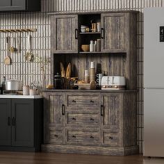 a kitchen area with a refrigerator, sink and cabinets