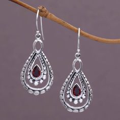 A pear-shaped garnet glistens at the heart of each of these dazzling dangle earrings. Using a combination of handmade and casting techniques artisan Nyoman Rena of Indonesia crafts the earrings from sterling silver. Teardrop Garnet For Jewelry Making, Garnet Teardrop Jewelry With Matching Earrings, Pear-shaped Teardrop Earrings As Gift, Teardrop Garnet Jewelry For Anniversary, Teardrop Garnet Silver Jewelry, Garnet Teardrop Earrings, Paw Print Jewelry, Ribbon Jewelry, Printed Jewelry