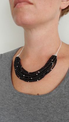 Black Multi Stranded Statement Bib Necklace Layered Seed Beads Silver Multi-strand Beaded Necklace With Black Beads, Black Multi-strand Necklace With Silver Beads, Black Multi-strand Necklace With Faceted Beads, Black Tiny Beads Necklace For Party, Black Necklace With Tiny Beads For Party, Statement Bib Necklace, Necklace Layered, Stylish Necklace, Black Seed