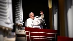 the pope waves from his balcony at an audience