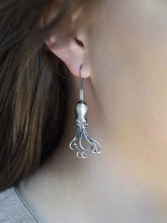 Original earrings made of 925 silver depicting an octopus. Oxidized finish. Color: gray. Length of earrings 4.9 cm, width: 2.3 cm. Precisely made, they look beautiful. Look Beautiful, Octopus, Jewelry Earrings Dangle, Poland, 925 Silver, Dangle Drop Earrings, Dangle Earrings, Jewelry Earrings, Drop Earrings