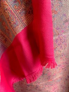 This Kashmiri pashmina blended shawl is super soft and is a perfect gift to own or for a return favor. The shawl is around 2.15 m in length and is a bright cherry shade. Covered with paisley weaving and motifs, the shawl is great for all seasons and of course for the winter. Can be worn on sarees as well. This shawl is full size and is broad as well. Beautiful Kashmiri pashmina shawls with paisley weaving | pashmina stole | pashmina scarf | return gift | favors | pashmina shawl online shopping | Indian Pashmina Shawl, Elegant Handloom Pashmina Shawl, Elegant Festival Pashmina Shawl, Pink Pashmina Shawl Scarf, Red Jamawar Pashmina Shawl, Pashmina Shawl As Gift, Pashmina Shawl For Gift, Festive Pashmina Handloom Shawl, Festive Handloom Pashmina Scarf