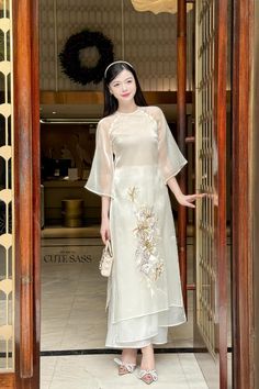 ❣️ This set includes one Ao Dai Top, 1 Pants Style: Modern  Material: Silk, Organza Chiffon. Non Stretch ❣️ This beautiful and modern ao dai set is perfect for any special occasions: Lunar NewYear, Mid Autumn Festival, Attending Wedding, or a Family photoshoot. ❣️ Please note: - Sizing may run smaller than American standard sizes, please refer to the sizing charts for sizing. - Please contact us if you have any questions ❣️We are proud to provide you with the highest quality fabric, handpicked m Elegant Embroidered Ao Dai For Summer, Traditional Sheer Wedding Sets, Elegant Short Sleeve Sets With Floral Embroidery, Traditional Sheer Sets For Festive Occasions, Chiffon Wedding Sets For Summer, Summer Chiffon Wedding Sets, White Summer Sets With Set-in Sleeves, Elegant Summer Ao Dai For Festive Occasions, Elegant Summer Festive Ao Dai