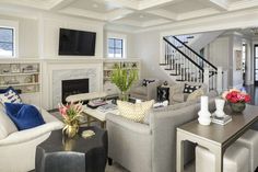 a living room filled with furniture and a fire place