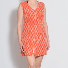 Channel retro vibes with this 60s shift dress, perfect for a chic, mod look. Featuring a bold orange and white argyle pattern, this sleeveless mini dress is designed with a scoop neck and an easy zip-up front. Its classic narrow A-line silhouette offers a flattering fit, ideal for a Twiggy-inspired outfit. Sized for US 8-10, it's a must-have for any vintage lover's wardrobe. Detail: * Fabric: Synthetic * Condition: very good vintage,  * Circa: 1960s * Care Label missing Fit: * Best fit Medium - Large US 8- 10 * * Please refer to measurements below for a proper fit * MEASUREMENTS: The sizes in the listing titles are estimates, please make sure to compare the measurements with a piece you own, to make sure the item will fit. Taken from seam to seam while the garment is lying flat. Double the 60s Shift Dress, Twiggy Fashion, Mod Look, Style Outfits, Sleeveless Mini Dress, Look Chic, Shift Dress, Dress Clothes For Women, Scoop Neck