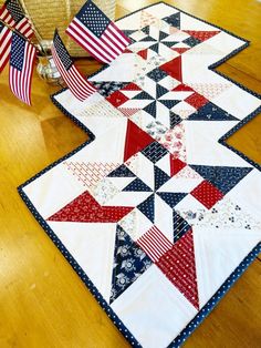 an american flag table runner is on the floor