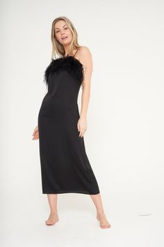 "Our Black Feather Slip Dress is the newest addition to our collection and boasts elegance and femininity. Made from a luxuriously silky material, this dress features a beautiful detachable feather trim on the bust for easy washing. This Dress is both lightweight and breathable, so you'll look and feel fabulous all night long. Wear it around the home or dress it up with a pair of heels for a night out. Fabric Composition 95% Polyester, 5% Spandex Model Height: 5\"6' Size: UK 6-8 wearing a Small Chic Evening Maxi Dress With Feather Trim, Elegant Sleeveless Evening Dress For Costume Party, Evening Maxi Dress With Feather Trim, Fitted Satin Dress With Feather Trim, Fitted Feather Trim Maxi Dress For Party, Fitted Maxi Dress With Feather Trim For Party, Evening Slip Dress For Party Season, Elegant Sleeveless Maxi Dress For Costume Party, Formal Black Evening Dress With Feather Trim