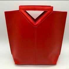 New Kenzo Red Poly Faux Leather Handbag Tote Bag. Easy To Clean Material. Size: 14.5 L4.5 W Brand New In Sealed Bag. Trendy Red Top Handle Bucket Bag, Chic Red Bucket Bag With Top Carry Handle, Red Satchel Bucket Bag With Top Carry Handle, Red Double Handle Bucket Bag With Top Carry, Modern Red Bag With Removable Pouch, Everyday Red Bucket Bag With Top Handle, Everyday Red Bucket Bag With Top Carry Handle, Red Bucket Bag With Top Carry Handle For Everyday, Trendy Red Double Handle Bucket Bag