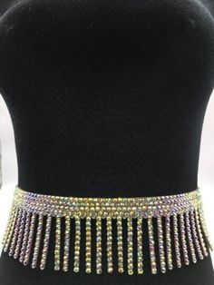 Sparkly rhinestone belt. Made with glass crystals. Don't stretch.  Snap closure.  Width: 2 3/4 inches (7 cm) Adjustable Rhinestone Party Belts, Fitted Rhinestone Belts For Party, Silver Bling Belts For Party, Silver Party Belt With Bling, Silver Rhinestone Belt For Party, Fitted Crystal Bridal Belt For Party, Gold Rhinestone Party Belt, Silver Fitted Belts For Party, Silver Fitted Belt For Party