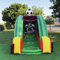 an inflatable soccer goal with a ball on top