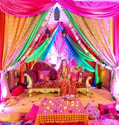 Rainbow setting for a mendhi or sangeet.  Indian wedding decor, Arabian Party, Mehndi Stage, Mehndi Party, Tafel Decor, Bollywood Party, Mehndi Decor, Wedding Stage Decorations, Punjabi Wedding