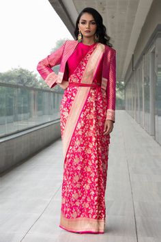 Fuchsia saree with Banarasi zari floral motifs. Paired with front-open floral brocade motif jacket and halter-neck blouse.
Component: 3

Neckline: Halter
Sleeve Length: Three quarter
Fabric: Saree: Pure Katan Silk, Blouse: Raw Silk, Jacket: Brocade
Color: Pink
Note: Bag and belt worn by the model is not for sale - Aza Fashions Katan Blouse Design, Katan Saree Blouse Design, Jacket On Saree, Banarasi Saree Blouse Design Back, Jacket Blouse Designs For Saree, Brocade Saree Blouse Designs, Jacket Blouse Saree, Sari With Jacket, Banarasi Blouse Designs Latest